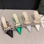 Exquisite Zara Satin Heels   Elevate your evening ensemble with these stunning Zara satin heels. Adorned with sparkling diamante bows and elegant straps, these mules blend luxurious texture with a bold, glamorous design. Perfect for making a statement at any special occasion.